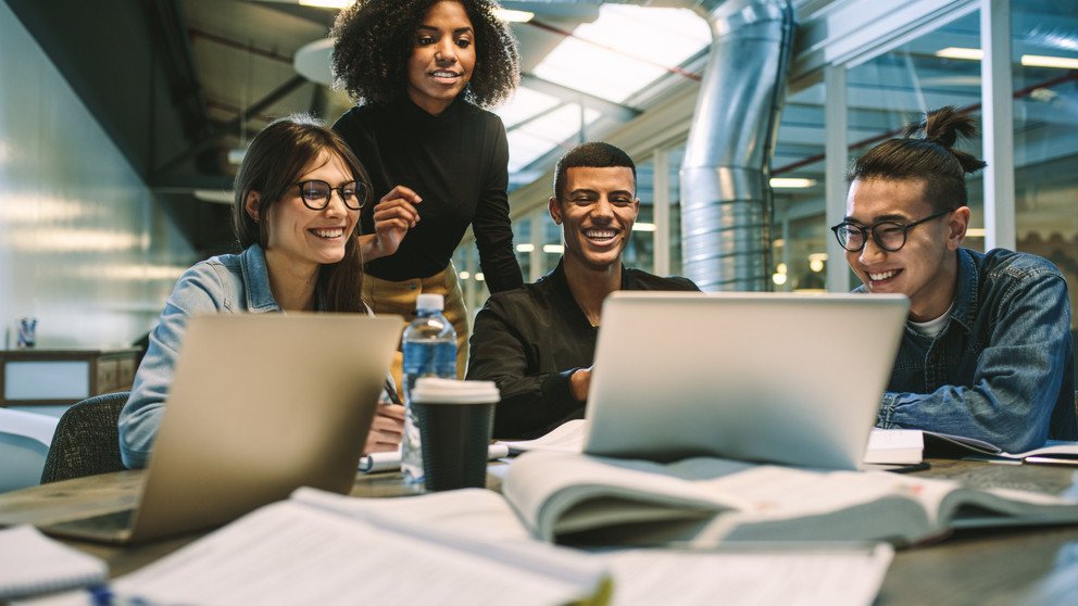 This picture shows a group of young reseachers working together.